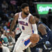 Philadelphia 76ers forward Paul George (8) handles the ball ahead of Memphis Grizzlies forward Jaren Jackson Jr. (13) in the first half of an NBA basketball game Wednesday, Nov. 20, 2024, in Memphis, Tenn. (AP Photo/Brandon Dill)