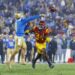 UCLA quarterback Ethan Garbers delivers a pass under pressure from USC defensive end Braylan Shelby at the Rose Bowl.