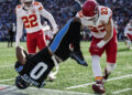 Kansas City Chiefs linebacker Drue Tranquill (23) hits Carolina Panthers tight end Ja'Tavion Sanders (0) during the first half of an NFL football game, Sunday, Nov. 24, 2024, in Charlotte, N.C. Sanders, was taken off the field due to injury after the play. (AP Photo/Rusty Jones)