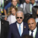 U.S. President Joe Biden arrives late for the group photo during the G20 Summit in Rio de Janeiro, Monday, Nov. 18, 2024. (AP Photo/Eraldo Peres)