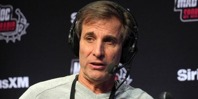 Chris Russo on his radio set