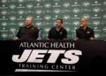 New York Jets general manager Joe Douglas, quarterback Aaron Rodgers and head coach Robert Saleh attend a press conference at Atlantic Health Jets Training Center on April 26, 2023 in Florham Park, New Jersey.