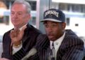 Deion Sanders talks to reporters at a press conference in Irving, Texas after the Dallas Cowboys signed him for "significant dollars." Cowboys owner Jerry Jones (L), who declined to release details of the contract said "Its a done deal."