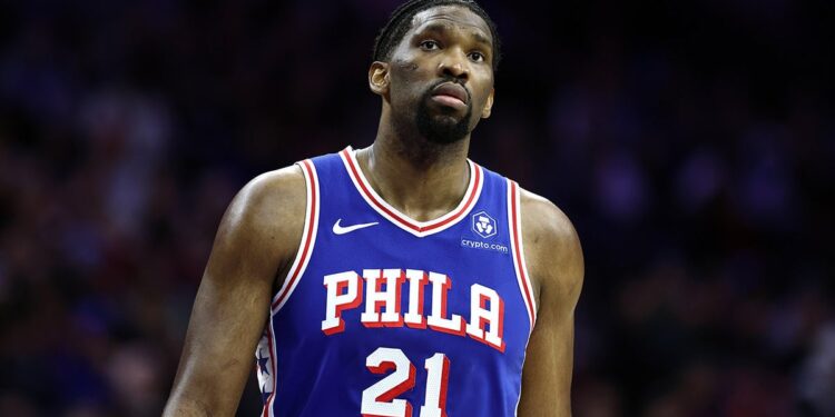 Joel Embiid looks on during a game