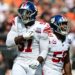 New York Giants linebacker Bobby Okereke and New York Giants linebacker Azeez Ojulari celebrate after a sack during the first quarter against the Cleveland Browns at Huntington Bank Field.