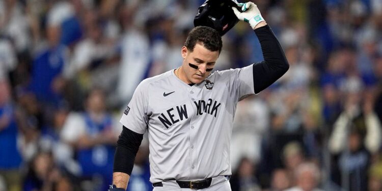 Anthony Rizzo tosses helmet