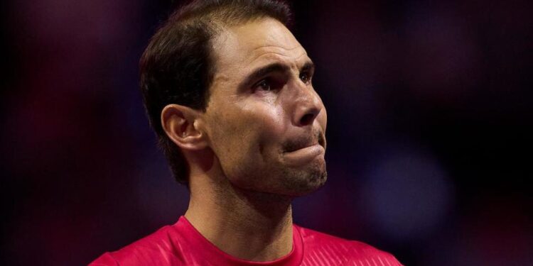 An emotional Rafael Nadal watches a tribute video after retiring from tennis