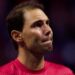 An emotional Rafael Nadal watches a tribute video after retiring from tennis