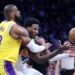 Los Angeles, California November 13, 2024-Lakers LeBron James tries to steal the ball away from Grizzlies Jaren Jackson Jr. in the first half at Crypto.com Arena Wednesday. (Wally Skalij/Los Angeles Times)