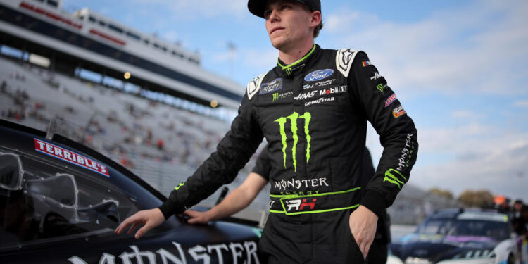 MARTINSVILLE, VIRGINIA - NOVEMBER 01: Riley Herbst, driver of the #98 Monster Energy Ford, walks the grid during qualifying for the NASCAR Xfinity Series National Debt Relief 250 at Martinsville Speedway on November 01, 2024 in Martinsville, Virginia. (Photo by Jonathan Bachman/Getty Images)