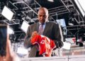 Charles Barkley signs a jersey