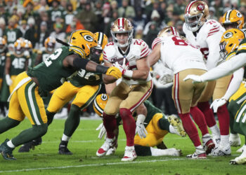 GREEN BAY, WISCONSIN - NOVEMBER 24: Running back Christian McCaffrey #23 of the San Francisco 49ers runs the ball during the first half of an NFL football game against the Green Bay Packers at Lambeau Field on November 24, 2024 in Green Bay, Wisconsin. (Photo by Todd Rosenberg/Getty Images)