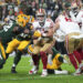 GREEN BAY, WISCONSIN - NOVEMBER 24: Running back Christian McCaffrey #23 of the San Francisco 49ers runs the ball during the first half of an NFL football game against the Green Bay Packers at Lambeau Field on November 24, 2024 in Green Bay, Wisconsin. (Photo by Todd Rosenberg/Getty Images)