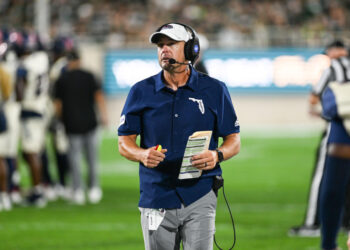 EAST LANSING, MI - AUGUST 30: Florida Atlantic Owls head coach Tom Herman talks to his coaches in the booth during a college football game between the Michigan State Spartans and the Florida Atlantic Owls on August 30, 2024, at Spartan Stadium in East Lansing, MI. (Photo by Adam Ruff/Icon Sportswire via Getty Images)