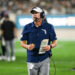 EAST LANSING, MI - AUGUST 30: Florida Atlantic Owls head coach Tom Herman talks to his coaches in the booth during a college football game between the Michigan State Spartans and the Florida Atlantic Owls on August 30, 2024, at Spartan Stadium in East Lansing, MI. (Photo by Adam Ruff/Icon Sportswire via Getty Images)