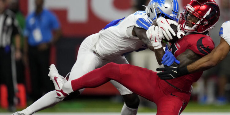 Houston Texans wide receiver John Metchie III catches a 15-yard touchdown pass in front of Detroit Lions cornerback Terrion Arnold. (AP Photo/David J. Phillip)