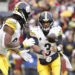 Nov 10, 2024; Landover, Maryland, USA; Pittsburgh Steelers quarterback Russell Wilson (3) tosses the ball to Steelers running back Najee Harris (22) during the second half against the Washington Commanders at Northwest Stadium. Mandatory Credit: Amber Searls-Imagn Images