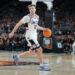 GLENDALE, ARIZONA - APRIL 08:  Cam Spencer #12 of the Connecticut Huskies dribbles the ball during the National College Basketball Championship game against the Purdue Boilermakers at State Farm Stadium on April 08, 2024 in Glendale, Arizona.  (Photo by Mitchell Layton/Getty Images)