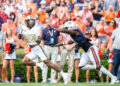 AUBURN, ALABAMA - NOVEMBER 02: Running back AJ Newberry #23 of the Vanderbilt Commodores catches a pass for a touchdown in front of linebacker Eugene Asante #9 of the Auburn Tigers during the first half of play at Jordan-Hare Stadium on November 02, 2024 in Auburn, Alabama. (Photo by Michael Chang/Getty Images)