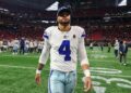 Dak Prescott walks off field