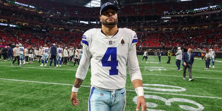 Dak Prescott walks off field