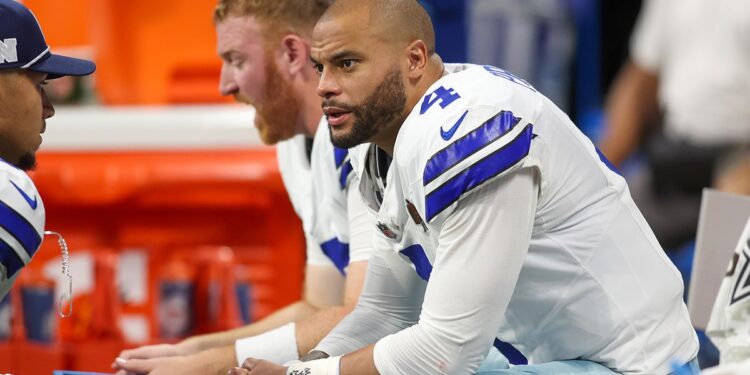 Dak Prescott sits on bench