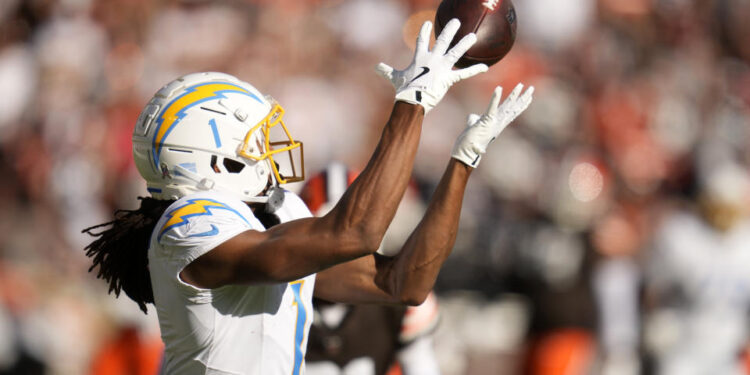 Los Angeles Chargers wide receiver Quentin Johnston (1) catches a 66-yard touchdown pass against the Cleveland Browns in the first half of an NFL football game Sunday, Nov. 3, 2024, in Cleveland. (AP Photo/Sue Ogrocki)