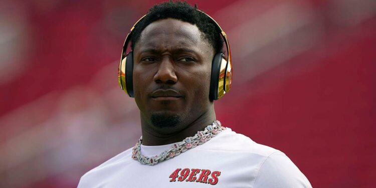 Deebo Samuel Sr warms up before a game