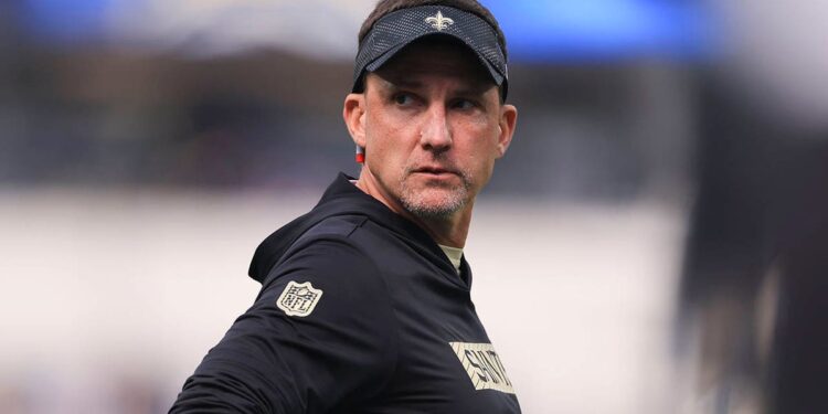 Dennis Allen looks on