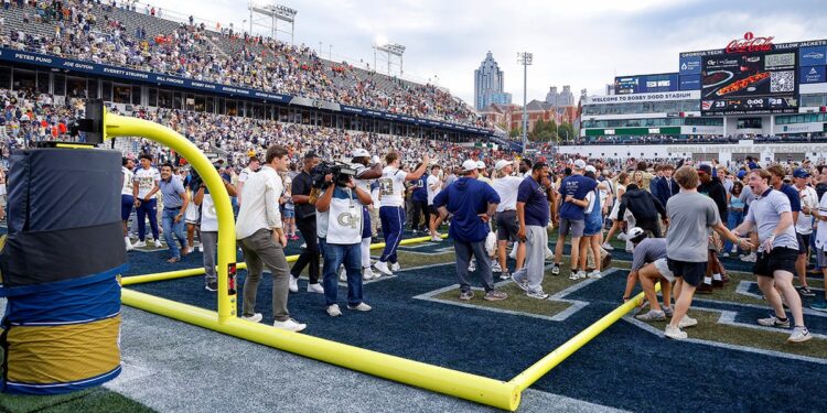 Georgia Tech students storm the field