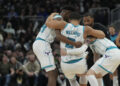 MILWAUKEE, WISCONSIN - NOVEMBER 23: Grant Williams #2 of the Charlotte Hornets helped by his teammates after being injured during the fourth quarter of a game against the Milwaukee Bucks at Fiserv Forum on November 23, 2024 in Milwaukee, Wisconsin. NOTE TO USER: User expressly acknowledges and agrees that, by downloading and or using this photograph, User is consenting to the terms and conditions of the Getty Images License Agreement. (Photo by Patrick McDermott/Getty Images)