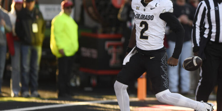 Colorado's quarterback Shedeur Sanders (2) celebrates his touchdown against Texas Tech during the second half of an NCAA college football game, Saturday, Nov. 9, 2024, in Lubbock, Texas. (AP Photo/Annie Rice)