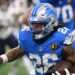 Detroit Lions running back Jahmyr Gibbs runs with the ball