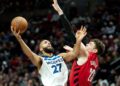 Minnesota Timberwolves center Rudy Gobert, #27, shoots over Portland Trail Blazers center Donovan Clingan, #23, during the second half of an Emirates NBA Cup basketball game in Portland, Oregon, on Tuesday, Nov. 12, 2024.