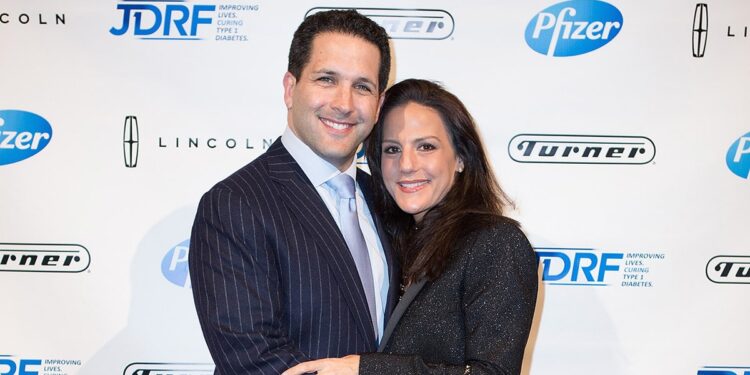 Adam Schefter with wife