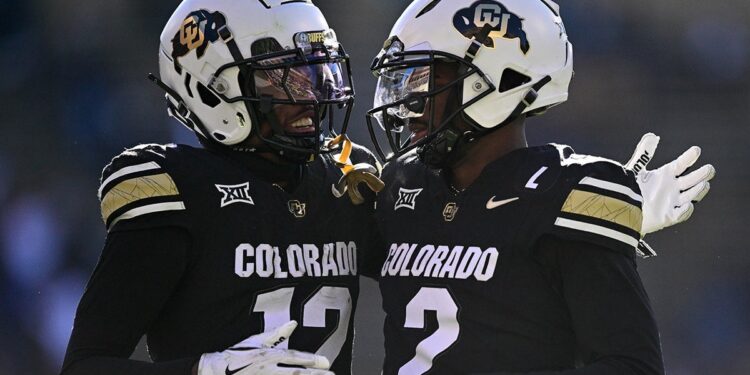 Shedeur Sanders and Travis Hunter celebrate