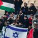 Fans hold Israel and Palestine flag