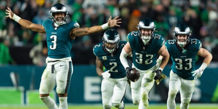 Philadelphia Eagles safety Reed Blankenship celebrates with teammates after his interception during the fourth quarter against the Washington Commanders at Lincoln Financial Field. Mandatory Credit: Bill Streicher-Imagn Images