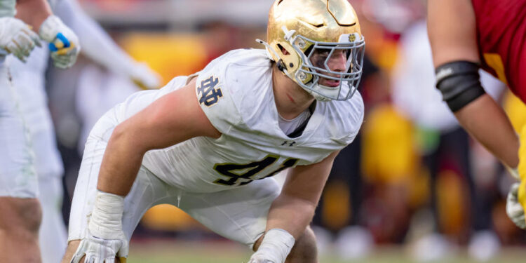 LOS ANGELES, CA - NOVEMBER 30: Donovan Hinish #41 of the Notre Dame Fighting Irish on the line of scrimmage during a game between Notre Dame Fighting Irish and University of Southern California at Los Angeles Memorial Coliseum on November 30, 2024 in Los Angeles, California. (Photo by Melinda Meijer/ISI Photos/Getty Images)