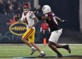 USC quarterback Jayden Maiava looks to pass under pressure from Texas A&M defensive lineman Cashius Howell.