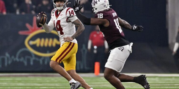 USC quarterback Jayden Maiava looks to pass under pressure from Texas A&M defensive lineman Cashius Howell.