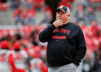 Ohio State offensive coordinator Chip Kelly stands on the field before a game against Indiana on Nov. 23.