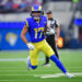 Dec 8, 2024; Inglewood, California, USA; Los Angeles Rams wide receiver Puka Nacua (17) runs the ball against the Buffalo Bills during the first half at SoFi Stadium. Mandatory Credit: Gary A. Vasquez-Imagn Images