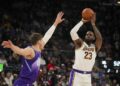 Los Angeles Lakers forward LeBron James (23) shoots the ball as Utah Jazz center Walker Kessler defends during the first half of an NBA basketball game, on Sunday, Dec. 1, 2024, in Salt Lake City. (AP Photo/Bethany Baker)