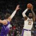 Los Angeles Lakers forward LeBron James (23) shoots the ball as Utah Jazz center Walker Kessler defends during the first half of an NBA basketball game, on Sunday, Dec. 1, 2024, in Salt Lake City. (AP Photo/Bethany Baker)