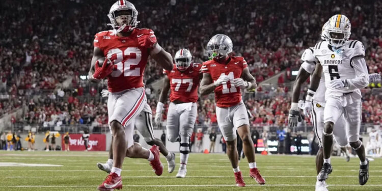 Sep 7, 2024; Columbus, Ohio, USA; Ohio State Buckeyes running back TreVeyon Henderson (32) runs for a touchdown against the Western Michigan Broncos during the second half at Ohio Stadium. Mandatory Credit: Adam Cairns-Imagn Images