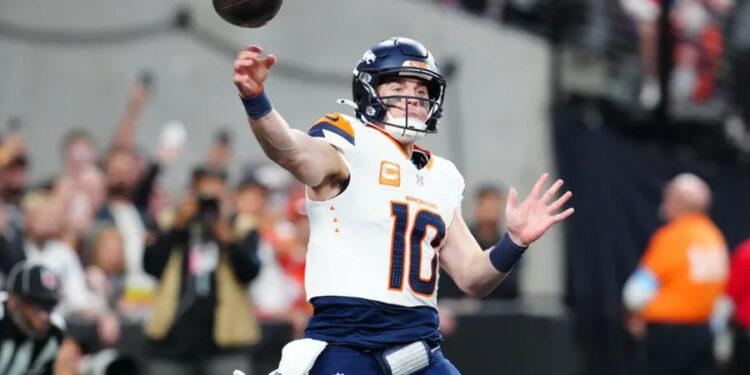 Nov 24, 2024; Paradise, Nevada, USA; Denver Broncos quarterback Bo Nix (10) makes a pass against the Las Vegas Raiders during the third quarter at Allegiant Stadium. Mandatory Credit: Stephen R. Sylvanie-Imagn Images