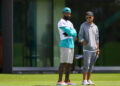 Jun 5, 2024; Miami Gardens, FL, USA; Miami Dolphins wide receiver Odell Beckham Jr. (3) and head coach Mike McDaniel look on during mandatory minicamp at Baptist Health Training Complex. Mandatory Credit: Sam Navarro-USA TODAY Sports