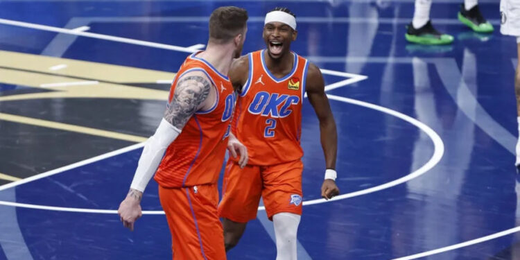 Dec 10, 2024; Oklahoma City, Oklahoma, USA; Oklahoma City Thunder guard Shai Gilgeous-Alexander (2) celebrates with center Isaiah Hartenstein (55) after he dunks against the Dallas Mavericks during the third quarter at Paycom Center. Mandatory Credit: Alonzo Adams-Imagn Images