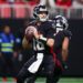 Dec 1, 2024; Atlanta, Georgia, USA; Atlanta Falcons quarterback Kirk Cousins (18) drops back to pass against the Los Angeles Chargers in the fourth quarter at Mercedes-Benz Stadium. Mandatory Credit: Brett Davis-Imagn Images